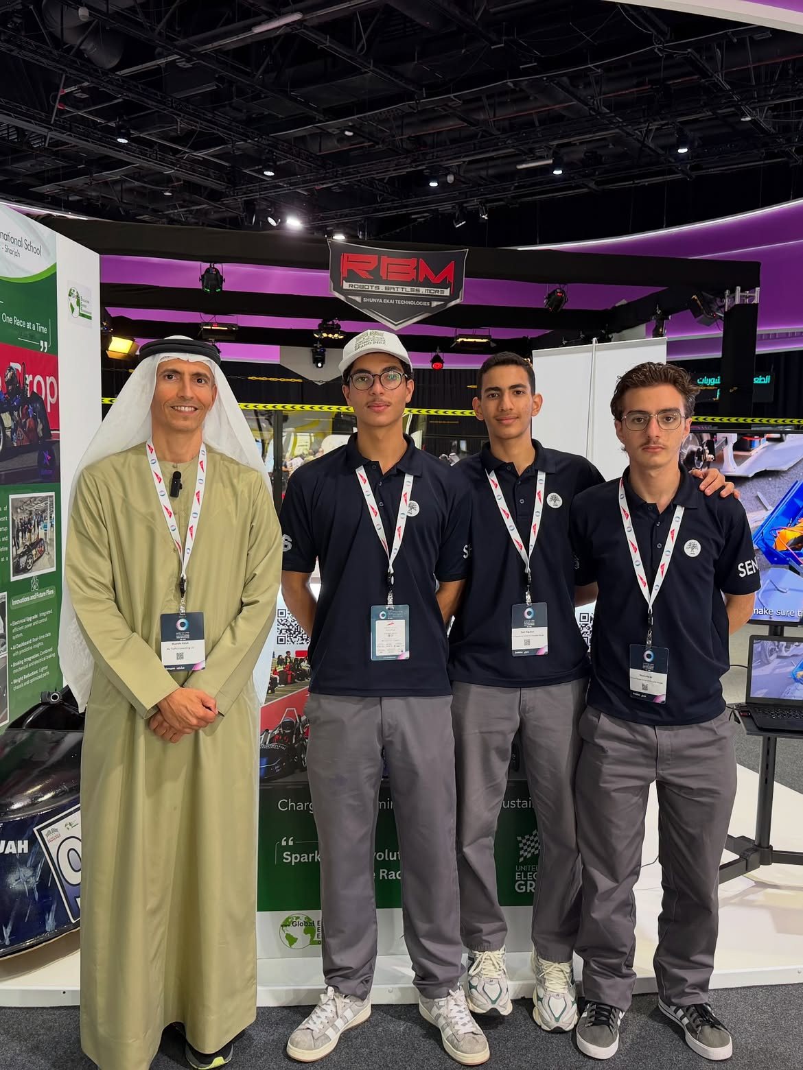 Younes Nader and the VoltStar EV team with a visitor at their exhibition booth during the RTA Dubai World Congress and Challenge for Self-Driving Transport